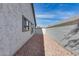 Landscaped side yard with gravel and block wall at 15547 W Magnolia St, Goodyear, AZ 85338