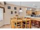 Casual dining area with wood table and chairs, adjacent to kitchen at 20566 N Lemon Drop Dr, Maricopa, AZ 85138