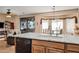 Kitchen features granite countertops, island, and breakfast bar at 20566 N Lemon Drop Dr, Maricopa, AZ 85138