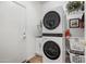 Laundry room with stackable washer and dryer, and cabinets at 20566 N Lemon Drop Dr, Maricopa, AZ 85138