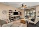 Bright and airy living room with large windows and access to a patio at 20566 N Lemon Drop Dr, Maricopa, AZ 85138