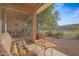 Relaxing patio with seating area and view of the golf course at 20566 N Lemon Drop Dr, Maricopa, AZ 85138