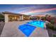 Luxury pool and spa at sunset with mountain views at 20728 W Pasadena Ave, Buckeye, AZ 85396