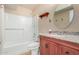 Bathroom with granite vanity, tub and shower combo at 2325 E Hermosa Dr, Tempe, AZ 85282