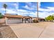 Single story home with a two-car garage and desert landscaping at 2325 E Hermosa Dr, Tempe, AZ 85282