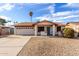 Single story home with a two-car garage and desert landscaping at 2325 E Hermosa Dr, Tempe, AZ 85282