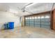 Garage with automatic door opener and storage at 2325 E Hermosa Dr, Tempe, AZ 85282