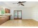 Kitchen with built-in shelving and sliding glass doors to backyard at 2325 E Hermosa Dr, Tempe, AZ 85282