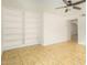 Bright living room with tile floors and built-in shelving at 2325 E Hermosa Dr, Tempe, AZ 85282