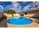Relaxing kidney-shaped pool in the backyard at 2325 E Hermosa Dr, Tempe, AZ 85282