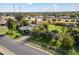 Aerial view of a ranch-style house with a large grassy yard and mature trees at 2975 E Campbell Rd, Gilbert, AZ 85234