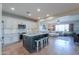 Spacious kitchen featuring granite countertops, an island, and ample cabinetry at 40748 W Chambers Dr, Maricopa, AZ 85138