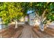 Pathway between two mature citrus trees in the backyard at 44 S Hawes Rd # A15, Mesa, AZ 85208