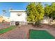 Backyard with putting greens and mature citrus trees at 44 S Hawes Rd # A15, Mesa, AZ 85208