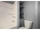 Main bathroom with tub, shower, and built-in shelving at 44 S Hawes Rd # A15, Mesa, AZ 85208