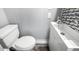 Bathroom with toilet, sink, and mosaic tile backsplash at 44 S Hawes Rd # A15, Mesa, AZ 85208