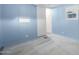 Light blue bedroom with carpet flooring and sliding door at 44 S Hawes Rd # A15, Mesa, AZ 85208