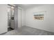 Bright bedroom with grey carpet, large closet, and en-suite bathroom at 44 S Hawes Rd # A15, Mesa, AZ 85208