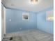 Light blue bedroom with carpet flooring and window at 44 S Hawes Rd # A15, Mesa, AZ 85208