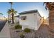 Side view of a white mobile home and palm trees at 44 S Hawes Rd # A15, Mesa, AZ 85208