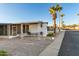 Mobile home with covered patio and seating area at 44 S Hawes Rd # A15, Mesa, AZ 85208