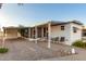 Mobile home with covered patio, table, and chairs at 44 S Hawes Rd # A15, Mesa, AZ 85208