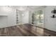 Open living area with wood-look flooring and access to the outdoors at 44 S Hawes Rd # A15, Mesa, AZ 85208