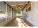 Covered porch with ceiling fan and outdoor access at 44 S Hawes Rd # A15, Mesa, AZ 85208