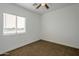 Simple bedroom with brown carpet and window blinds at 8245 W Pica Dr, Arizona City, AZ 85123