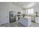 Modern kitchen with stainless steel appliances and island at 8245 W Pica Dr, Arizona City, AZ 85123