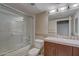 Clean bathroom with tiled shower/tub combo and vanity with granite countertop at 114 W Adams St # 506, Phoenix, AZ 85003