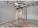 Spacious bedroom with hardwood floors and exposed concrete pillar at 114 W Adams St # 506, Phoenix, AZ 85003