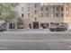 Exterior view of the building, showcasing its architecture and urban setting at 114 W Adams St # 506, Phoenix, AZ 85003
