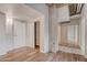 Bright entryway with hardwood floors, built-in shelving, and exposed concrete at 114 W Adams St # 506, Phoenix, AZ 85003