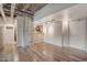 Open living area with hardwood floors and exposed beams and pipes at 114 W Adams St # 506, Phoenix, AZ 85003