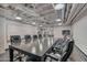 Modern meeting room with large table and chairs at 114 W Adams St # 506, Phoenix, AZ 85003