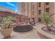 Community patio with seating, grill, and lush landscaping at 114 W Adams St # 506, Phoenix, AZ 85003