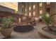 Community patio area with seating and plants at sunset at 114 W Adams St # 506, Phoenix, AZ 85003