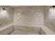 Modern steam room with marble walls and built-in seating at 114 W Adams St # 506, Phoenix, AZ 85003