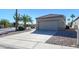 Two-car garage with desert landscaping at 16115 W Acacia Ct, Surprise, AZ 85374