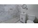 Clean bathroom with marble-tiled shower and modern vanity at 17842 N 43Rd St, Phoenix, AZ 85032