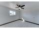 Bright bedroom with ceiling fan and window at 17842 N 43Rd St, Phoenix, AZ 85032
