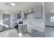 Updated kitchen featuring gray cabinets, stainless steel appliances, and tile flooring at 17842 N 43Rd St, Phoenix, AZ 85032