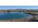 Serene lake view with mountain backdrop, creating a peaceful atmosphere at 18332 E Spring Valley Ct, Rio Verde, AZ 85263