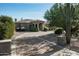 Luxury home with circular driveway and desert landscaping at 24209 N 87Th St, Scottsdale, AZ 85255