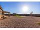 Artificial turf backyard with a covered patio and grill at 27712 N Hibiscus Ln, San Tan Valley, AZ 85143