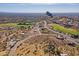 Aerial view of community with golf course and mountain views at 3877 S Veronica Ln, Gold Canyon, AZ 85118