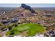 Aerial view of a luxury home community with a golf course and mountain views at 3877 S Veronica Ln, Gold Canyon, AZ 85118