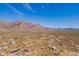 Aerial view of a desert community with mountain views at 3877 S Veronica Ln, Gold Canyon, AZ 85118