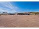 Large backyard showcasing a new home and mountain backdrop at 3877 S Veronica Ln, Gold Canyon, AZ 85118